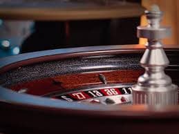Mobile phone showing live casino interface with game lobby